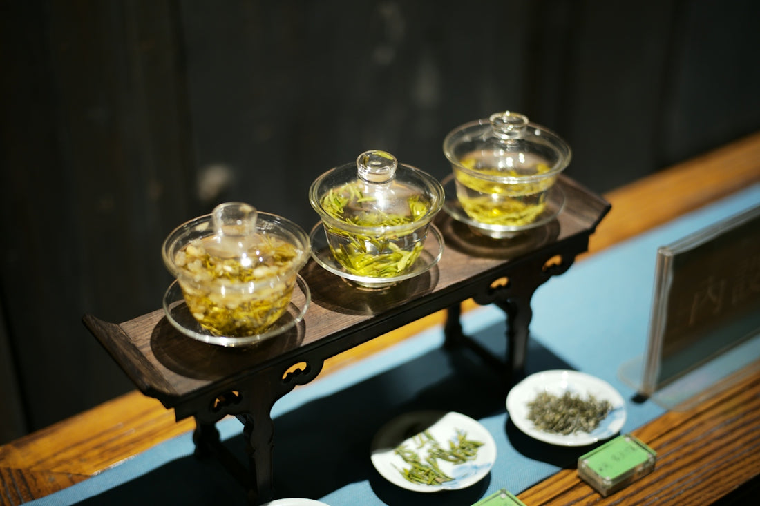 Three glasses of green tea on a tray