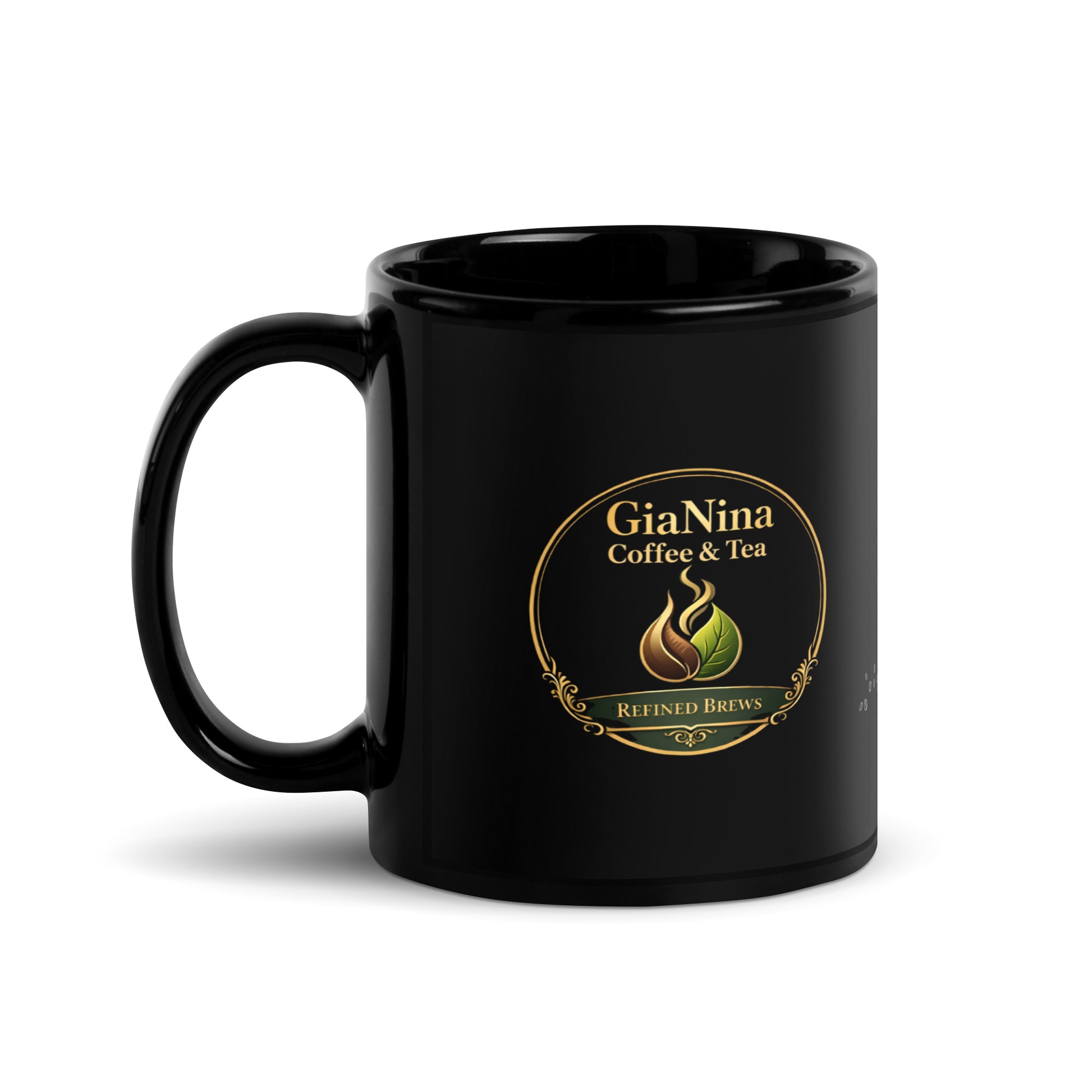 A glossy black ceramic mug featuring a circular gold and green GiaNina Coffee & Tea logo on the front, set against a plain white background.