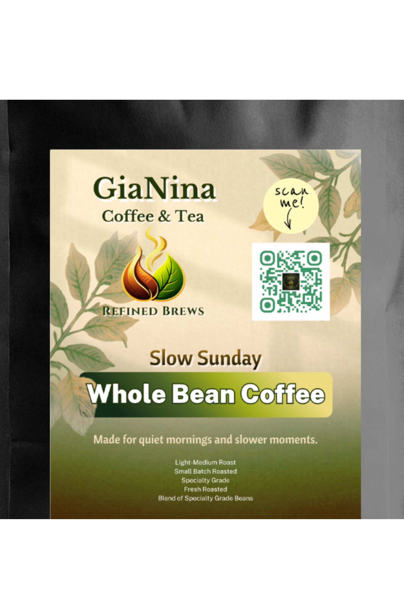 A package of GiaNina Coffee & Tea Slow Sunday Whole Bean Coffee, featuring a cream and green label with botanical illustrations, a QR code, and a 'scan me!' sticker, set against a dark background.