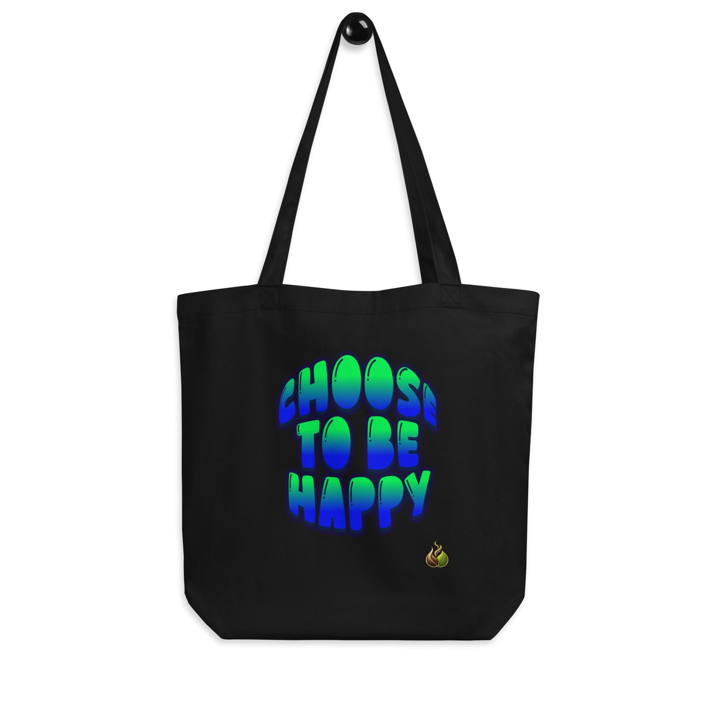 A black canvas tote bag with two shoulder straps, featuring the phrase 'CHOOS TO BE HAPPY' printed in a bold, 3D bubble-style font that gradients from green to blue. A small yellow flame graphic is printed near the bottom right of the text.
