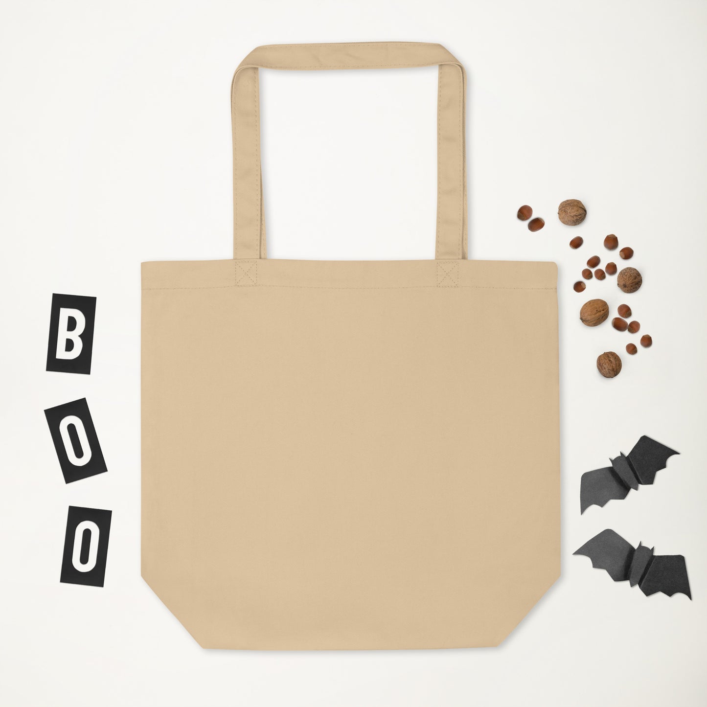 Beige tote bag with Halloween decorations on a white background