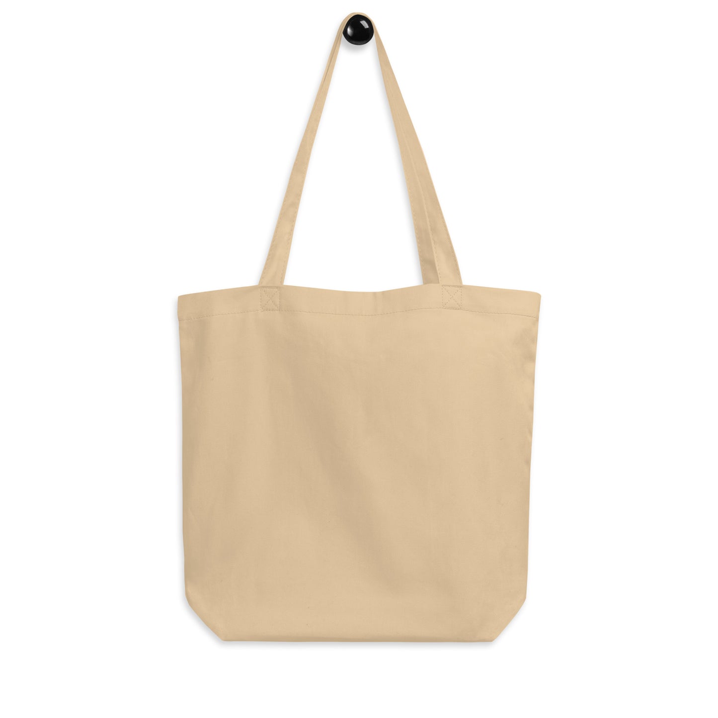 Beige tote bag with 'Vitacoty' logo on a white background