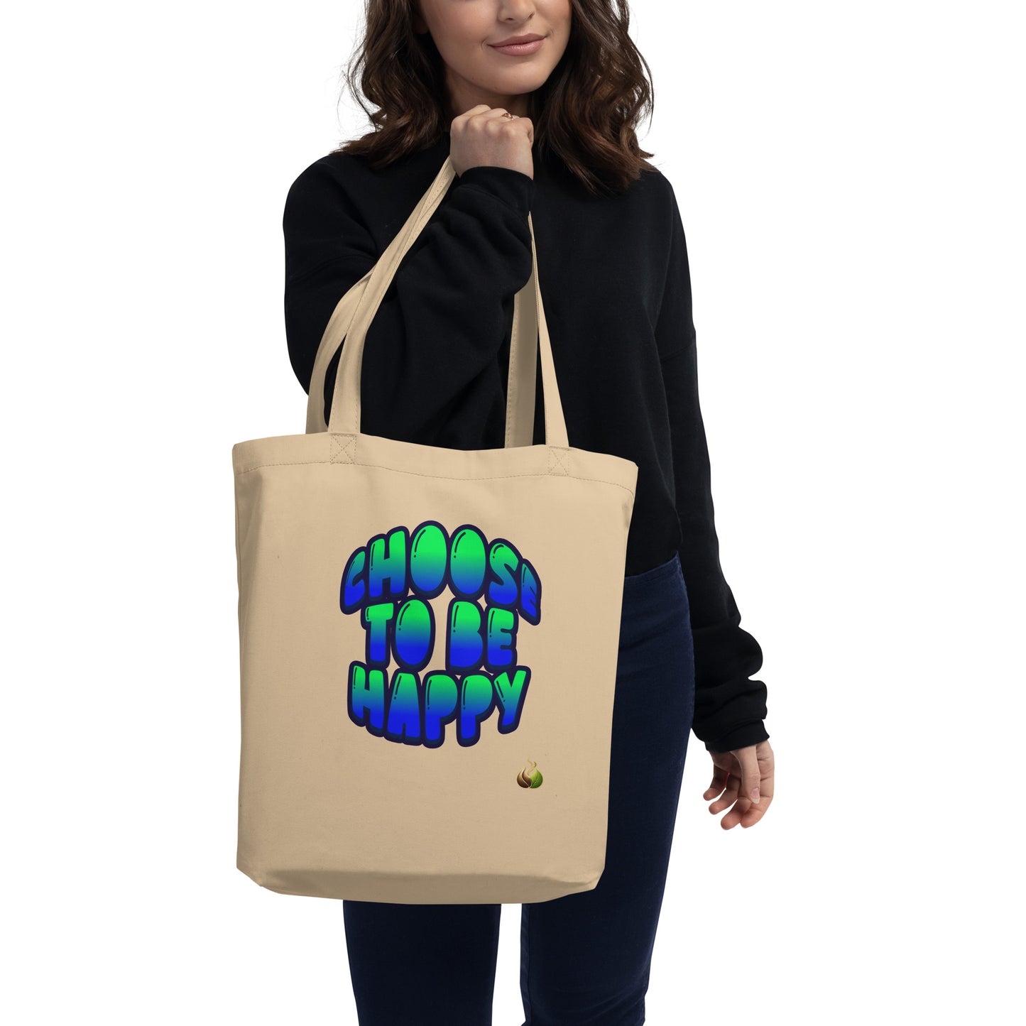A woman wearing a black sweatshirt and dark pants carries a beige canvas tote bag with the text 'CHOOS TO BE HAPPY' in a blue-to-green gradient bubble font on the front.