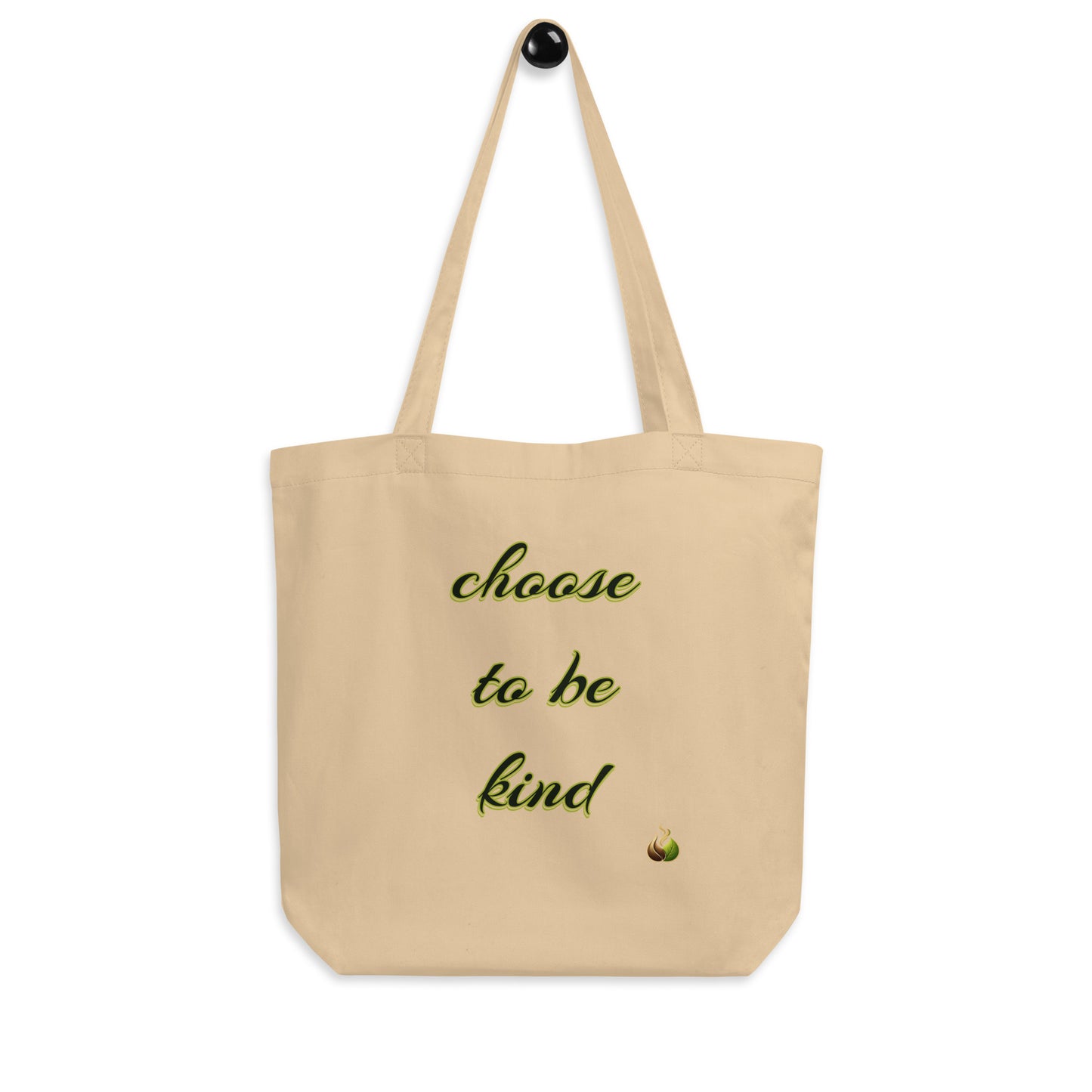 A beige canvas tote bag with two shoulder straps, featuring the phrase 'choose to be kind' printed in green script on the front, with a small flame icon below.