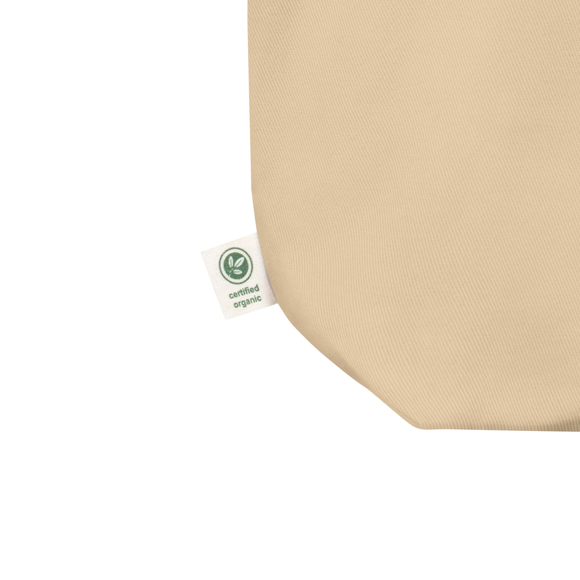 Beige fabric with a certified organic tag on a white background